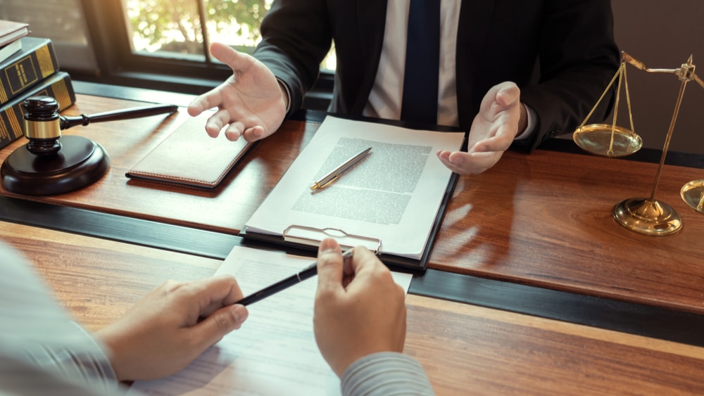 Richard Harris personal injury lawyer discussing a claim with a client